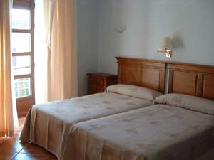 Standard single with city view, balcony, private shower shared toilet, and breakfast